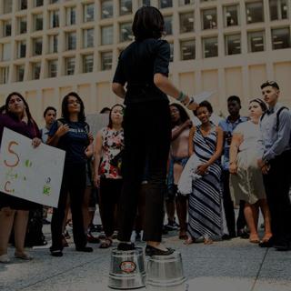 Students listening to a speaker