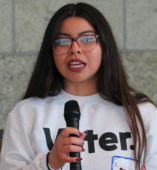 Student speaking into a microphone