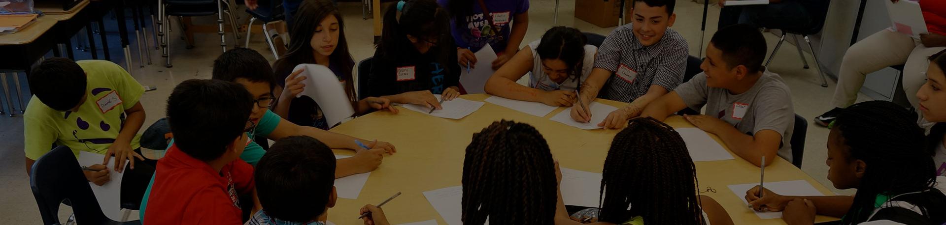 Students sitting around a desk